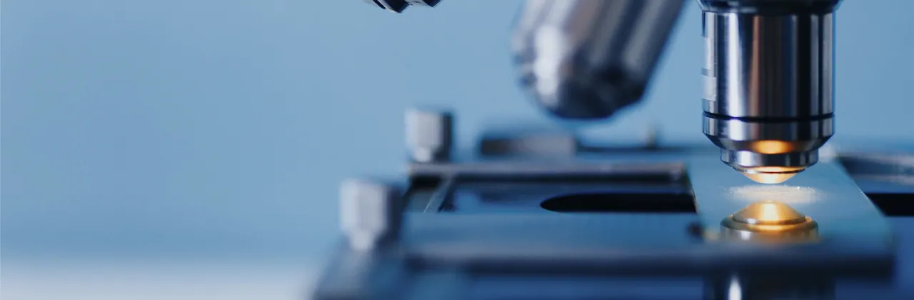 A laboratory microscope with its stage lit from below